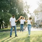 How is multilingual exposure effectively integrated into the International Montessori daily curriculum and activities?