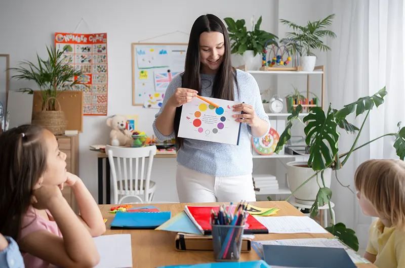 Front view teacher explaining kids